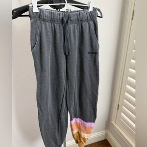 Rip Curl women’s Charcoal Joggers with Colorful Stripes